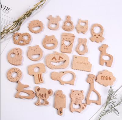 China Soft Toy Wholesale Natural Beech Wooden Animals Shaped Teether Baby Teether Toys Wooden Animal Rattle Baby Teethers for sale