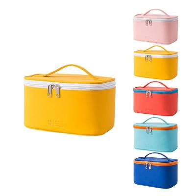 China Large Capacity Multifunctional Pure Color PU Three-piece Waterproof Wash Scrub Travel Storage Makeup Case Cosmetic Bags for sale