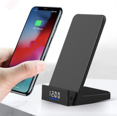 China Mobile Phone Qi Certificated Multi-Function Wireless Charging Stand 10W Wireless Phone Fast Wireless Charger With Clock for sale