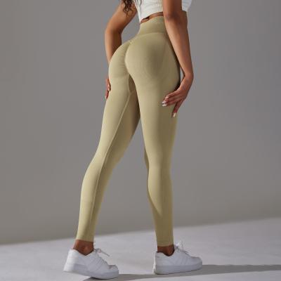 China Seamless knitted solid color high waist abs lifting hip yoga pants running fitness pants for sale