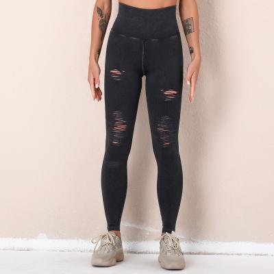 China Wash yoga pants hole hollowed out seamless high-waisted sports pants cropped hip fitness pants for sale