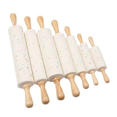 China Viable Most Popular Color Grain 4/5/7/8/9/10/11inch Mini Rolling Pin Non-Stick Silicone With Wooden Handle For Kids Adult for sale