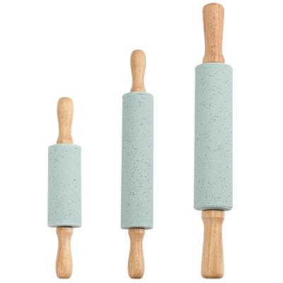 China Factory Price Viable Non-Stick Silicone Mini Rolling Pin With Wooden Handle For Dumpling Skin Artifact Baking Tools for sale