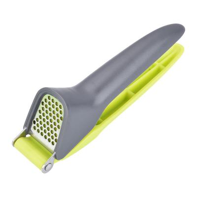 China Mini New Viable Green Plastic Handle Stainless Steel Manual Amazon Garlic Press Crusher For Home Kitchen for sale