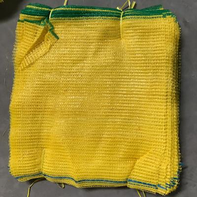 China Agriculture Yellow And Red 46x65cm Raschel Net Vegetable Packing Mesh Bags Vegetable Net Bag for sale