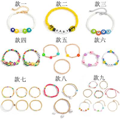 China FASHIONABLE Bohemian Colorful Flowers Beads Rice Beads Gold Round Beads Multilayer Elastic Bracelet for sale