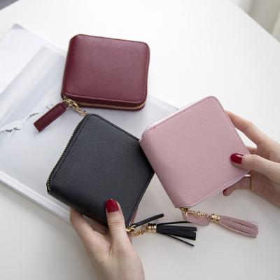 China Simple Mini Leather Wallet Women's Fashion Coin Purse Wholesale 2021 New Zipper Waterproof Tassel Wallet for sale