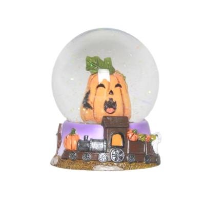 China China Handmade Resin Pumpkin Glass Snow Globe For Halloween Decoration for sale