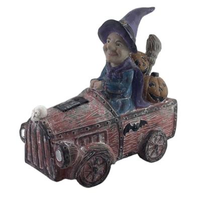 China Resin World Opens Halloween Witch Driving Car Statue With LED Lights Polyresin Solar Pumpkin Garden Decoration For Gifts for sale