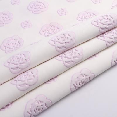 China Customized Viable Pattern White Embossed Pink Rose Floral 3d Scuba Knit Fabric Polyester for sale