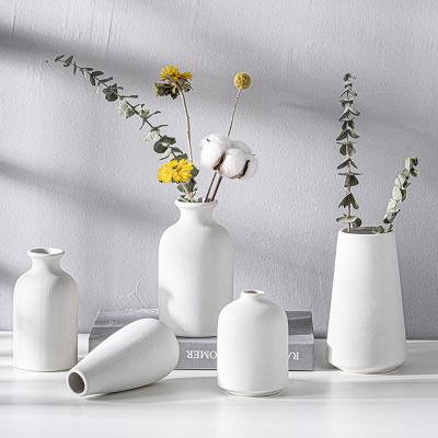 China Wholesale Minimalist Creative Table Centerpiece Decoration Mini Pottery Fragrance Bottle Wedding Ceramic Vases for sale