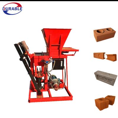 China Building Material Stores Manual Lego Interlocking Red Clay Soil Brick Making Machine for sale