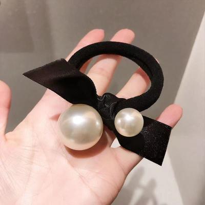 China 2021 Korean Black Girls Scrunchies Pearl Hair Ties Women's 2021 Attractive Bow Style Seamless High Stretchy Elastic Hair Bands for sale