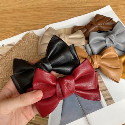 China Korean Style Fashion Autumn Winter Attractive Hair Clips Girls Kids Bareback Fashion Faux Leather PU Bow Hair Clips Hairpin for sale