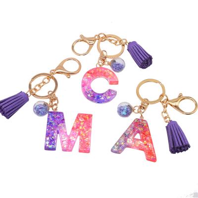 China Shiny Glossy Glitter Letters Contrast Color Splicing Purple Epoxy English Words Cute Fancy Key Chains for Women for sale