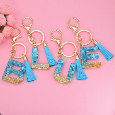 China Shiny Glossy Simple Men and Women Custom New Designer 26 Initial English Alphabet Letter Resin Keychain for sale