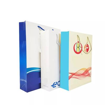 China Recycled Materials Customized Personalization High Quality Portable Shopping White Cardboard Bag for sale