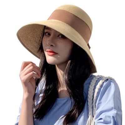 China Girl's Straw Bucket Hat Foldable Bucket Striped Bowknot Hat For Summer for sale