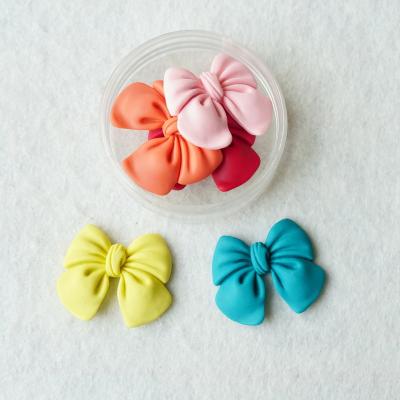 China 200Pcs/Bag Europe Resin Charms Flat Back Bow For DIY Hair Clip Jewelry Crafts Shape Ornaments for sale