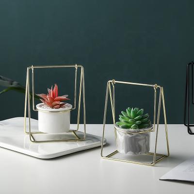 China Modern Nordic Ceramic Gold Black Swing Flower Rack Home Office Display Flower Pot Iron Decoration Plant Stand for sale