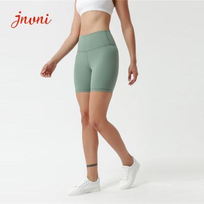 China Solid Color 80%Nylon Active Yoga Shorts Women'S Active Shorts With Waist Pocket for sale