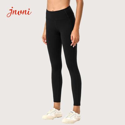 China Nude Feeling 80% Fabric Yoga Clothes For Women Black Leggings With Pockets for sale