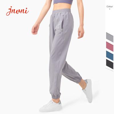 China Quickdrying Zipper Pockets Yoga Jogger Pants 130gsm Yoga Sweatpants Plus Size for sale