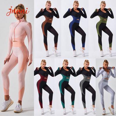 Chine Les femmes supérieures de culture de tirette Activewear de 2 morceaux ont placé les guêtres sans couture de yoga de haute taille à vendre