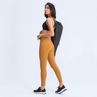 China 2021 Newest Women's Gym Wear Sporty Fitness Tight Running Breathable Wholesale High Waist Yoga Pants Leggings With Pockets for sale