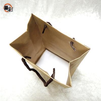 China 13*8*20cm handmade custom handmade flexiloop handle bag kraft paper for sale