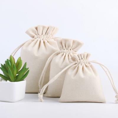 China Eco-friendly Natural Reusable Canvas Packaging Cotton Fabric Gift Jewelry Storage Drawstring Bags for sale