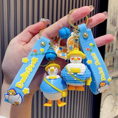 China Yellow Dickmon Duck Building Blocks Toys Bag Pendant Ornaments Backpack Wearing Hat Duck Keychains 3D Pendant Cartoon PVC for sale