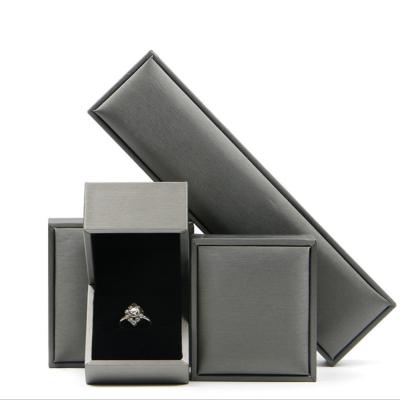 China Classic Luxury Leather Jewelry Boxes Eco-Friendly Ring Earring Box Fashion Customized Different Sizes Leather Jewelry Ring Box Empty Blue Box for sale