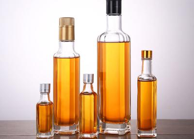 China Transparent Glass Oil Bottles Varity Capacity , Crystal Glass Camellia Oil Bottle for sale