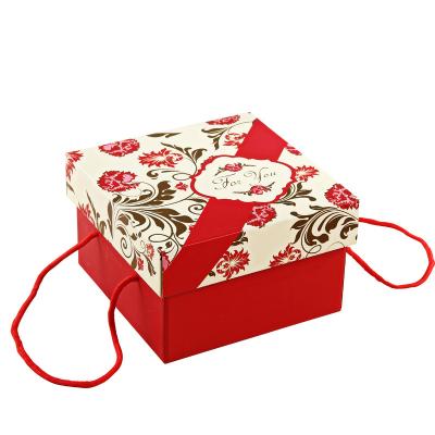 China Recyclable Red Folding Paper Gift Box With Ribbon Square Packaging Small Chocolate Box Wedding Candy Box for sale