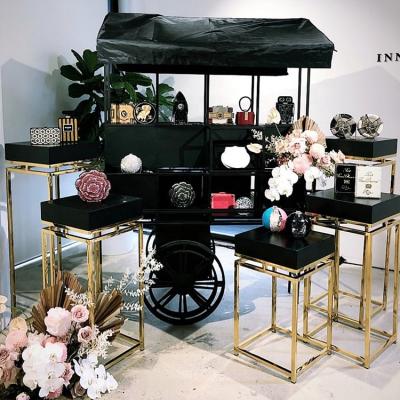 China 2021 Wedding Hot Sale White Black Mental Flower Carriage Candy Cart For Wedding Decoration for sale