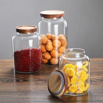 China 2023 Freshness Preservation Boroiliscate Kitchen Food Glass Storage Jars Tall Set With Bamboo Lid Glass Jar Set With Top Lid for sale