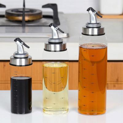 China Freshness Preservation 500ml Kitchen Cooking Olive Oil Glass Bottles With Metal for sale