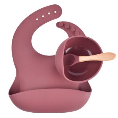 China 2021 rustic custom wholesale with spoon avoid wetting baby's clothes waterproof silicone bowl set silicone baby bibs for sale