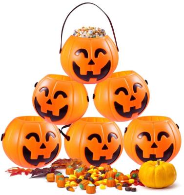 China Mini Halloween Portable Pumpkin Bucket Candy Buckets 12PCS 2.5 Inch Small Candy Buckets for Kids Trick or Treat for sale