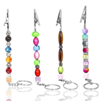 China Fanshion Pom Pom Ball Bling Key Chain Credit Card Grabber Bank ATM Card Cut Long Nail Cigarette Holder Card Grabber For Long Nails for sale