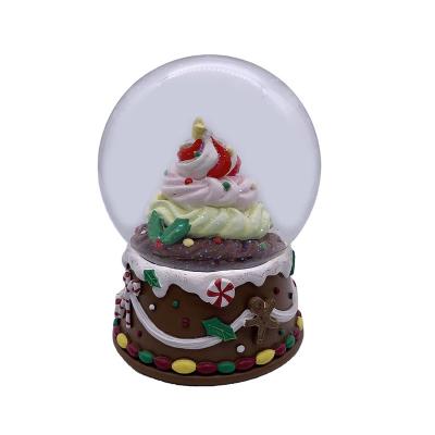 China Worldwide hand-painted 120MM resin gingerbread ice cream shopping snow globe glass for kids souvenir gift for sale