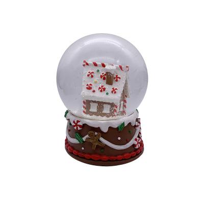 China Hand Painted 120MM Gingerbread House Shopping Snow Globe in Resin Glass World for Christmas Souvenir Gift for sale