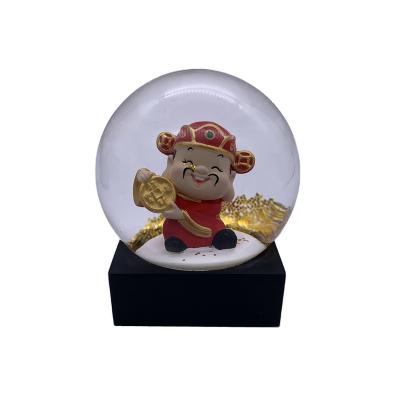 China Worldwide 2021 New 100MM Resin Creative Designed Glass God of Wealth Snow Globe for sale