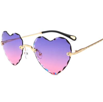 China Hiphop 2020 Custom Metal Love Gradient Shading Heart Rimless Glasses Shaped Sunglasses Women for sale