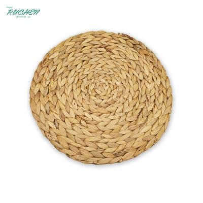 China 38cm Water Viable Squash Hyacinth Woven Placemat Round Rattan Pad Home Deco Non-Slip Coaster Dining Heat Resistant Rattan Table Mat for sale