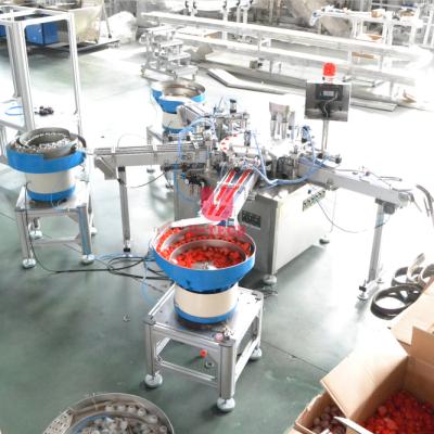 China Full Automatic Mineral Pure Plastic Capsule Assembly Machine Small Scale Food Drinking Water Assembling Machine Equipment for sale