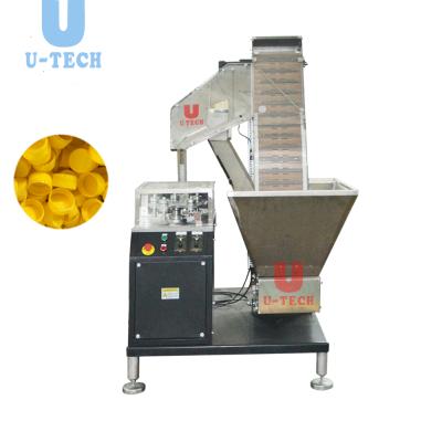 China Full Automatic High Efficiency Plastic Capsule Cap Slitting Folding Machine With Heater To Reduce Cap Price for sale