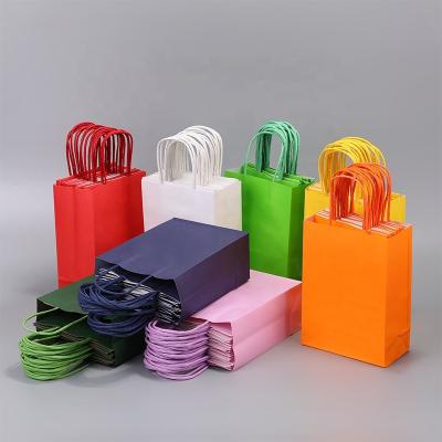 China Recycled Materials Customized Color And Logo Kraft Paper Bag With Handle Food Gift Flower Cloth Shoes Paper Bag for sale