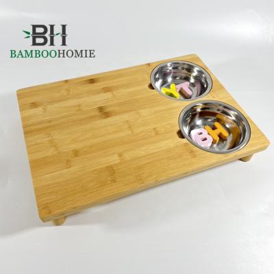 China Sustainable Nature Kitchen Bamboo Cutting Board with Two Stainless Bowls for sale